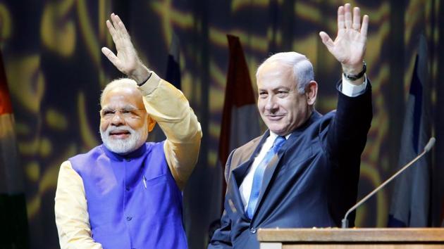 Israeli Prime Minister Benjamin Netanyahu (R) shakes hands with his Indian counterpart Narendra Modi during a meeting with Indian community in the Israeli coastal city of Tel Aviv, on July 5, 2017. Prime Minister Narendra Modi arrived in Israel for what he called a "groundbreaking" first ever visit by an Indian premier, with growing ties between the two countries including billion of dollars in defence deals. (AFP Photo) Israeli Prime Minister Benjamin Netanyahu (R) shakes hands with his Indian counterpart Narendra Modi during a meeting with Indian community in the Israeli coastal city of Tel Aviv, on July 5, 2017. Prime Minister Narendra Modi arrived in Israel for what he called a "groundbreaking" first ever visit by an Indian premier, with growing ties between the two countries including billion of dollars in defence deals. (AFP Photo)