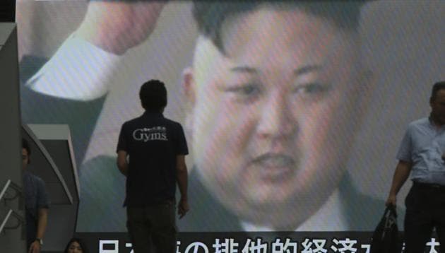People walk in front of an image of North Korean leader Kim Jong Un shown on a large screen as a TV news reports the North Korea's missile test which landed in the waters of Japan's economic zone, in Tokyo. (AP) People walk in front of an image of North Korean leader Kim Jong Un shown on a large screen as a TV news reports the North Korea's missile test which landed in the waters of Japan's economic zone, in Tokyo. (AP)