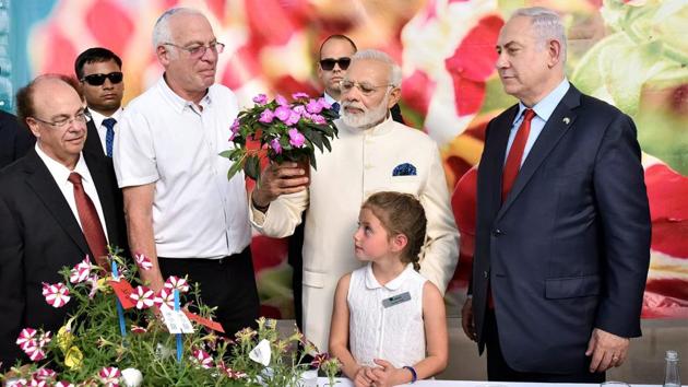 The two leaders then visited the Danziger Flower Farm where a fast growing variety of Chrysanthemum was named after Modi. (PTI) 