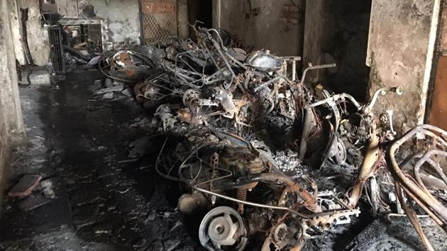 Charred remains of two wheelers gutted in a massive fire that broke out at a residential colony in east Delhi on Friday morning. (Ravi Choudhary/HT Photo) Charred remains of two wheelers gutted in a massive fire that broke out at a residential colony in east Delhi on Friday morning. (Ravi Choudhary/HT Photo)