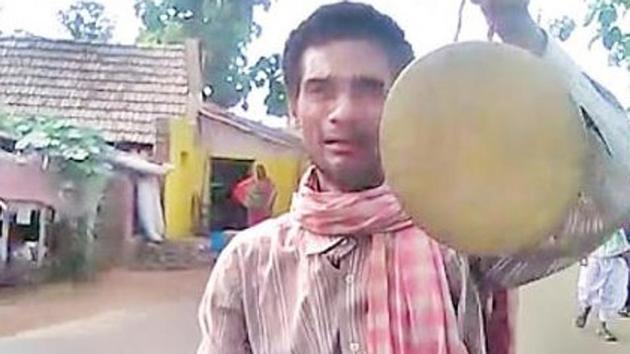 Dushmanta Sahu was forced to go around Ragudiapada village under Badakera grampanchayat by a kangaroo court as a punishment for his wife Mallika Sahu not voting for a particular candidate in a local election (Courtesy SAMBAD) Dushmanta Sahu was forced to go around Ragudiapada village under Badakera grampanchayat by a kangaroo court as a punishment for his wife Mallika Sahu not voting for a particular candidate in a local election (Courtesy SAMBAD)