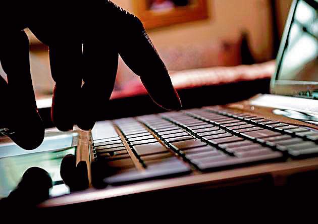 Cyber crime hacker typing on laptop. Cyber crime hacker typing on laptop.