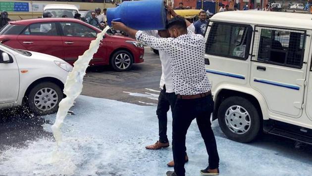 OBC leader Alpesh Thakor throws milk on road during a farmers agitation for loan waiver in Ahmedabad on Wednesday. (PTI) OBC leader Alpesh Thakor throws milk on road during a farmers agitation for loan waiver in Ahmedabad on Wednesday. (PTI)