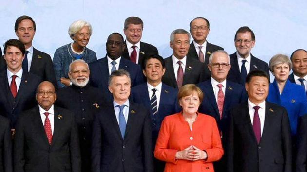 Prime Minister Narendra Modi with German Chancellor Angela Merkel and other leaders during the family photo at G-20 Summit in Hamburg, Germany on July 7, 2017. (PTI) Prime Minister Narendra Modi with German Chancellor Angela Merkel and other leaders during the family photo at G-20 Summit in Hamburg, Germany on July 7, 2017. (PTI)