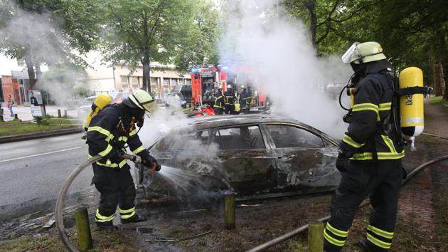 Firefighters put out a fire during a protest against the upcoming G-20 summit in Hamburg, Germany, Friday July 7, 2017. The leaders of the group of 20 meet Friday and Saturday in Hamburg. (AP Photo) Firefighters put out a fire during a protest against the upcoming G-20 summit in Hamburg, Germany, Friday July 7, 2017. The leaders of the group of 20 meet Friday and Saturday in Hamburg. (AP Photo)