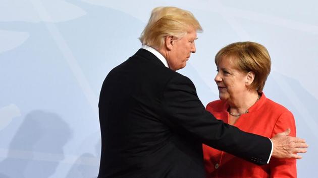 German Chancellor Angela Merkel greets US President Donald Trump at the start of the G20 meeting in Hamburg. (AFP)
