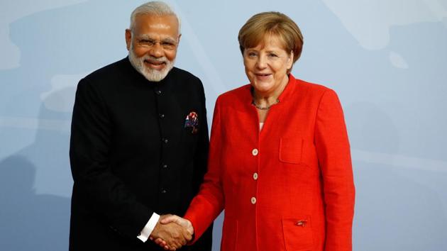German Chancellor Angela Merkel welcomes Prime Minister Narendra Modi as he arrives to attend the G20 summit in Hamburg. (AFP Photo) German Chancellor Angela Merkel welcomes Prime Minister Narendra Modi as he arrives to attend the G20 summit in Hamburg. (AFP Photo)