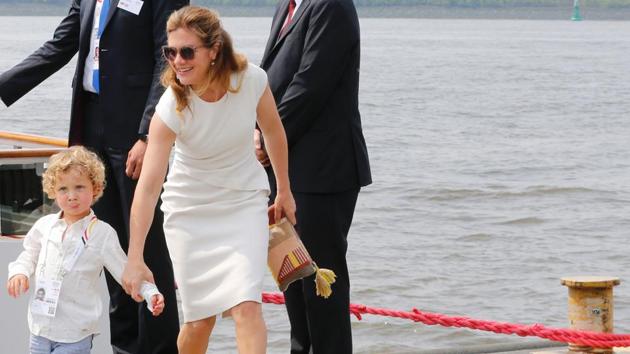 Wife of Canada's Prime Minister Sophie Gregoire and their son Hadrien leave a ship after a boat tour of the spouses program on the first day of the G-20 summit in Germany. (AFP)