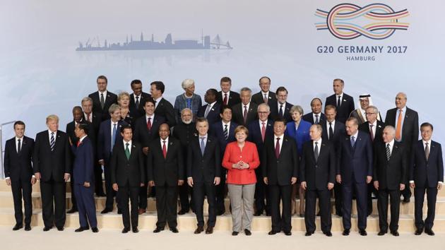 The participants pose for a group photo on the first day of the G-20 summit in Hamburg. While host German Chancellor Angela Merkel welcomed the leaders to open the 12th G20 Summit, a separate meeting of BRICKS leaders took place on the sidelines.Fighting terrorism, climate change and global trade are expected to be the key areas of discussion at the two-day Summit, whose theme is ‘Shaping an ‘Inter- connected World’ (AP)
