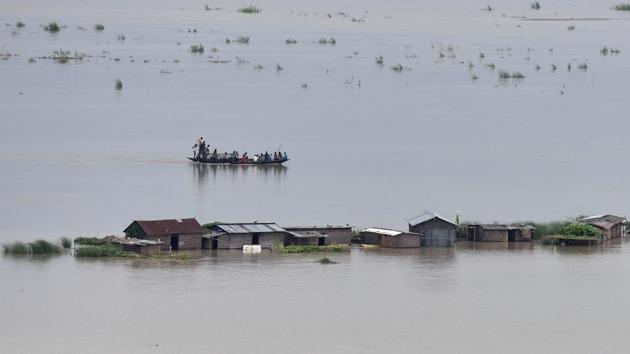 With the Brahamaputra river level on a rising trend all the sluice gates that allow accumulated water in the city to be drained out to the river have been closed to prevent backflow of the water of Brahmaputra into the city. (Biju BORO /AFP)