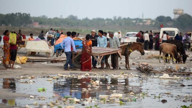 Indian vendors prepare to move their makeshift shelters from the banks of the Ganga river as the water level of the Ganges and Yamuna rivers rises due to heavy rainfall, in Allahabad. (AFP) Indian vendors prepare to move their makeshift shelters from the banks of the Ganga river as the water level of the Ganges and Yamuna rivers rises due to heavy rainfall, in Allahabad. (AFP)