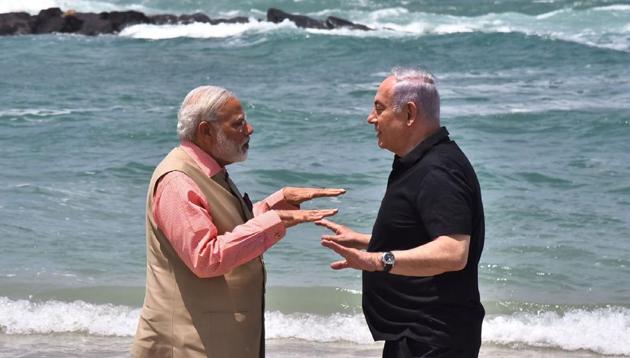 Indian Prime Minister Narendra Modi and Isreali Prime Minister Benjamin Netanyahu gesture as they talk on Olga Beach in Hadera. Prime Minister Narendra Modi held talks with Benjamin Netanyahu July 6 on the first ever visit by an Indian premier to Israel as they sought to deepen ties beyond high-priced defence deals. (AFP) Indian Prime Minister Narendra Modi and Isreali Prime Minister Benjamin Netanyahu gesture as they talk on Olga Beach in Hadera. Prime Minister Narendra Modi held talks with Benjamin Netanyahu July 6 on the first ever visit by an Indian premier to Israel as they sought to deepen ties beyond high-priced defence deals. (AFP)
