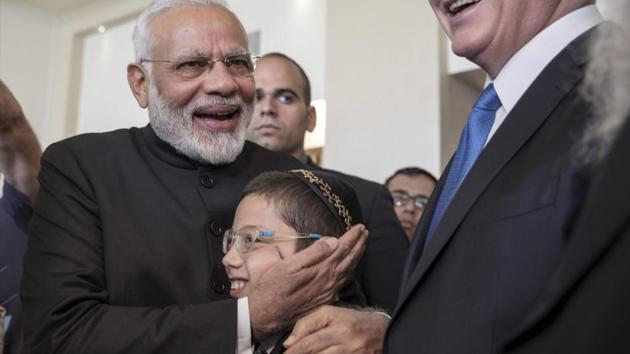 Indian Prime Minister Narendra Modi,left, with Israeli Prime Minister Benjamin Netanyahu,center right, meet with Moshe Holtzberg, center, an Israeli boy, whose parents were killed in the Nov. 26, 2008 terrorist attack on the Mumbai, Chabad House, in Jerusalem. (AP) Indian Prime Minister Narendra Modi,left, with Israeli Prime Minister Benjamin Netanyahu,center right, meet with Moshe Holtzberg, center, an Israeli boy, whose parents were killed in the Nov. 26, 2008 terrorist attack on the Mumbai, Chabad House, in Jerusalem. (AP)