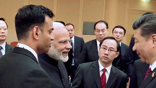 Prime Minister Narendra Modi and Chinese President Xi Jinping at the BRICS leaders' informal gathering in Hamburg, Germany, on Friday. (PTI Photo) Prime Minister Narendra Modi and Chinese President Xi Jinping at the BRICS leaders' informal gathering in Hamburg, Germany, on Friday. (PTI Photo)