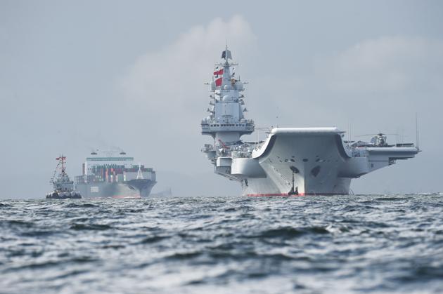 China's aircraft carrier, the Liaoning (right), arrives in Hong Kong waters on July 7, 2017. (AFP) China's aircraft carrier, the Liaoning (right), arrives in Hong Kong waters on July 7, 2017. (AFP)