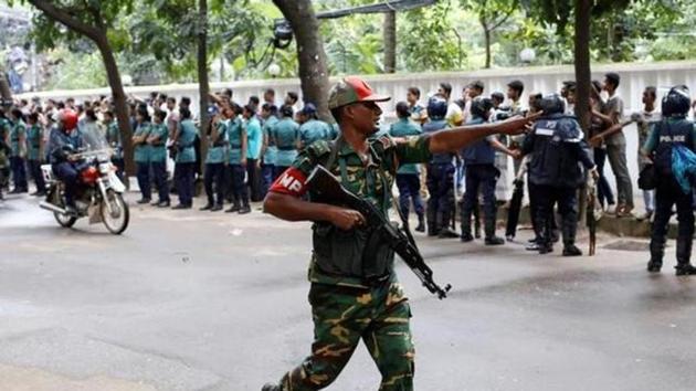 A securityman reacts near the Holey Artisan restaurant after gunmen attacked the upscale cafe in Dhaka in July, 2016. (File Photo) A securityman reacts near the Holey Artisan restaurant after gunmen attacked the upscale cafe in Dhaka in July, 2016. (File Photo)