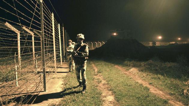 Border Security Force (BSF) soldiers standing guard during a night patrol near the fence at the India-Pakistan International Border at the outpost of Akhnoor sector, about 40 km from Jammu, on Sunday, October 2, 2016. (HT File Photo) Border Security Force (BSF) soldiers standing guard during a night patrol near the fence at the India-Pakistan International Border at the outpost of Akhnoor sector, about 40 km from Jammu, on Sunday, October 2, 2016. (HT File Photo)
