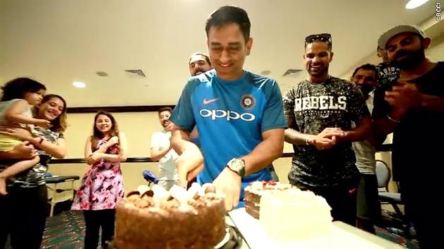 Yuvraj Singh, Shikhar Dhawan and Virat Kohli eagerly await their share of the cake. (BCCI) 