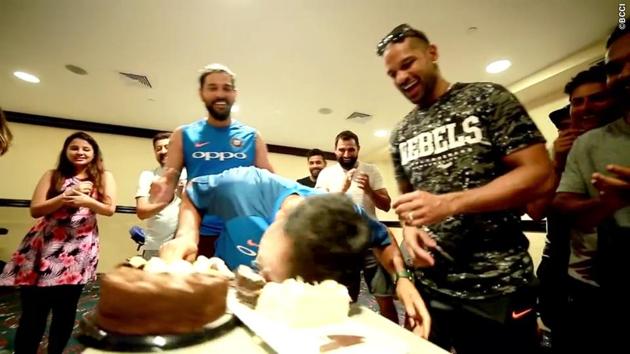 Dhoni then denies them a chance to rub cake on his face by doing it himself! (BCCI) 
