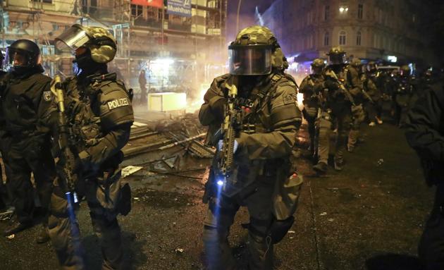 Members of the German special police force walk through the Schanze district following clashes with anti-G20 protesters in Hamburg on July 8, 2017. (Reuters) Members of the German special police force walk through the Schanze district following clashes with anti-G20 protesters in Hamburg on July 8, 2017. (Reuters)
