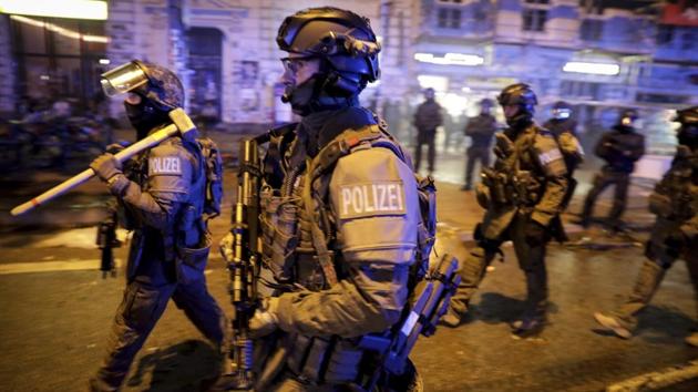 Police said riots were extremely aggressive in the early hours of Saturday in the city’s neighbourhoodsss, which is only a few hundred meters (yards) away from the summit grounds. (AP) Police said riots were extremely aggressive in the early hours of Saturday in the city’s neighbourhoodsss, which is only a few hundred meters (yards) away from the summit grounds. (AP)