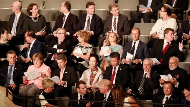 (1st row L-R) French President Emmanuel Macron and his wife Brigitte Trogneux, US President Donald Trump and US First Lady Melania Trump; (2nd row L-R) German Chancellor Angela Merkel and husband of the German Chancellor Joachim Sauer, China's President Xi Jinping and wife of China's President Peng Liyuan attend a concert at the Elbphilharmonie concert hall during the G20 Summit in Hamburg. (AFP)