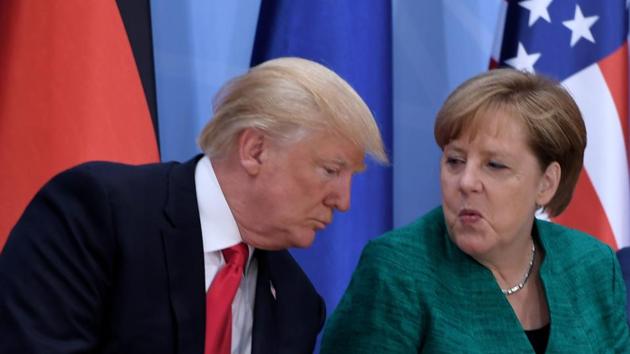 US President Donald Trump (L) and German Chancellor Angela Merkel attend the panel discussion "Launch Event Women's Entrepreneur Finance Initiative" on the second day of the Summit in Hamburg. (AFP)