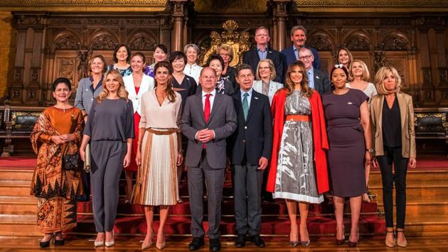 Hamburg's mayor Olaf Scholz (first row, C-L) poses with partners of the G20 summit participants at the city hall in Hamburg. (AFP)