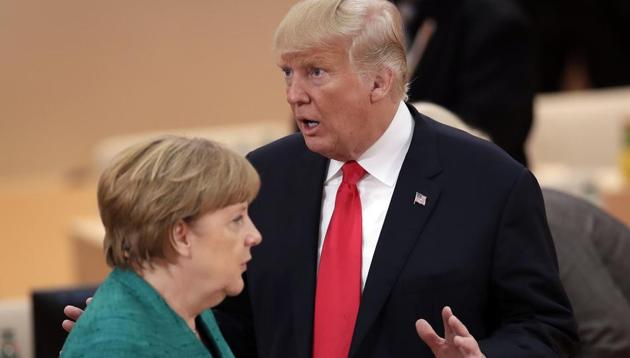 German Chancellor Angela Merkel and US President Donald Trump during a working session at the G-20 summit in Hamburg, Germany on July 8, 2017. (AP) German Chancellor Angela Merkel and US President Donald Trump during a working session at the G-20 summit in Hamburg, Germany on July 8, 2017. (AP)