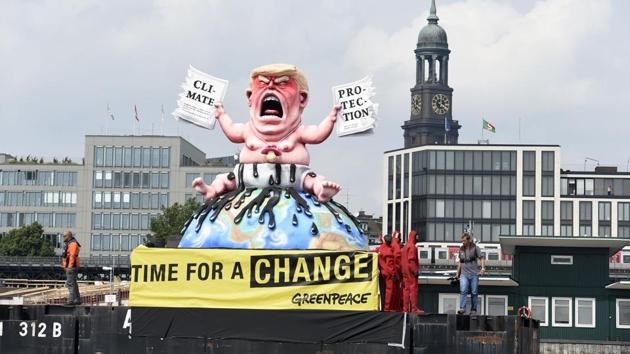 Greenpeace activists stand next to the giant statue of the U.S. President Donald Trump during the protest at the G20 summit in Hamburg. (REUTERS) Greenpeace activists stand next to the giant statue of the U.S. President Donald Trump during the protest at the G20 summit in Hamburg. (REUTERS)