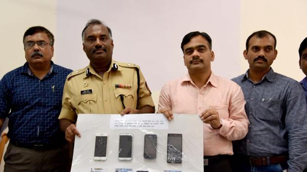 The Navi Mumbai police show recovered phones and bogus ID cards at the police commissioner’s office on Friday.(Bachchan Kumar)