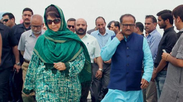 Jammu and Kashmir deputy chief minister Nirmal Kumar Singh (in blue kurta), seen here with CM Mehbooba Mufti, says Pakistan always tries to create problems in the state.(PTI File Photo)