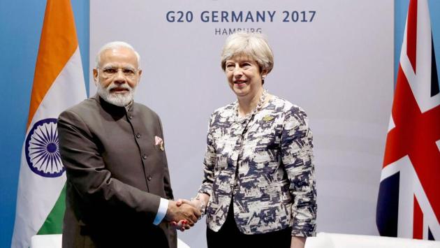 Prime Minister Narendra Modi met his British counterpart Theresa May on the sidelines of the G20 Summit and sought Britain’s cooperation for the return of Indian economic offenders. (PTI)