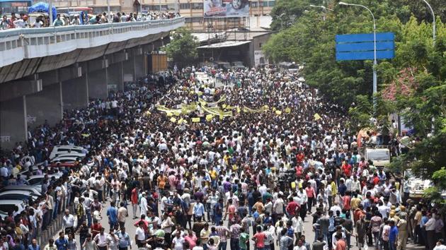 Textile traders take out a rally against the Goods and Services Tax in Surat on Saturday.(PTI Photo)