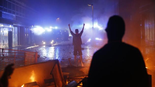 A protester gestures towards police during demonstrations. G20 participants said they had never seen protesters closer to such a summit than in Hamburg (REUTERS) A protester gestures towards police during demonstrations. G20 participants said they had never seen protesters closer to such a summit than in Hamburg (REUTERS)