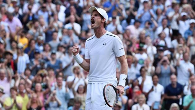 Britain's Andy Murray celebrates beating Italy's Fabio Fognini during their men's singles third round match on the fifth day of the 2017 Wimbledon Championships at The All England Lawn Tennis Club in Wimbledon, southwest London, on Friday.(AFP)