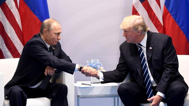 US President Donald Trump and Russia's President Vladimir Putin shake hands during a meeting on the sidelines of the G20 Summit in Hamburg, Germany, on Friday. (AFP Photo) US President Donald Trump and Russia's President Vladimir Putin shake hands during a meeting on the sidelines of the G20 Summit in Hamburg, Germany, on Friday. (AFP Photo)