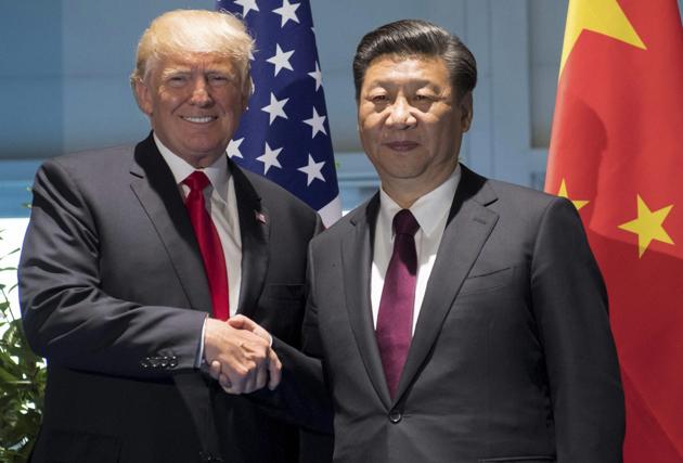 US President Donald Trump and Chinese President Xi Jinping at the G20 Summit in Hamburg on July 8, 2017. PTI(AP7_8_2017_000173B) (AP) US President Donald Trump and Chinese President Xi Jinping at the G20 Summit in Hamburg on July 8, 2017. PTI(AP7_8_2017_000173B) (AP)