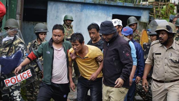 An injured man is taken away following clashes between Gorkhaland supporters and police in Sonada near Darjeeling on Saturday, July 8, 2017. (AFP) An injured man is taken away following clashes between Gorkhaland supporters and police in Sonada near Darjeeling on Saturday, July 8, 2017. (AFP)
