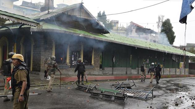 Policemen near a burning railway station on Saturday during an indefinite strike called by the Gorkha Janamukti Morcha (GJM) in Darjeeling. (AFP) Policemen near a burning railway station on Saturday during an indefinite strike called by the Gorkha Janamukti Morcha (GJM) in Darjeeling. (AFP)