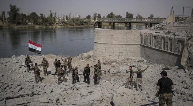 Iraqi Special Forces soldiers celebrate after reaching the bank of the Tigris river as their fight against Islamic State militants continues in parts of the Old City of Mosul, Iraq on July 9.(AP Photo) Iraqi Special Forces soldiers celebrate after reaching the bank of the Tigris river as their fight against Islamic State militants continues in parts of the Old City of Mosul, Iraq on July 9.(AP Photo)