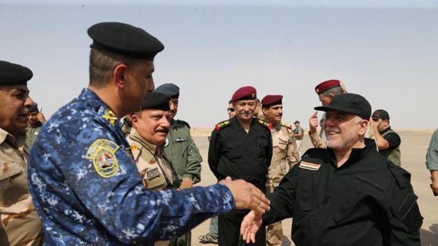 Iraqi Prime Minister Haider al-Abadi (R) is pictured in Mosul, July 9, 2017. (Reuters Photo) Iraqi Prime Minister Haider al-Abadi (R) is pictured in Mosul, July 9, 2017. (Reuters Photo)