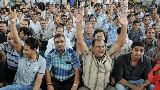 Textile traders chant slogans during a protest against GST in Surat on July 6, 2017.(PTI)