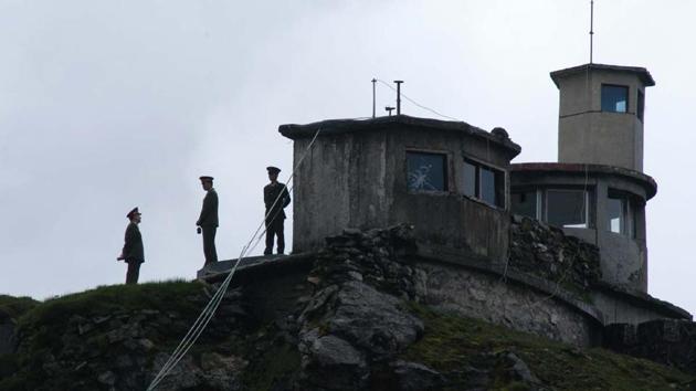 Chinese army personnel keep a close watch on Indian territory, at Nathula pass.(HT File Photo) Chinese army personnel keep a close watch on Indian territory, at Nathula pass.(HT File Photo)