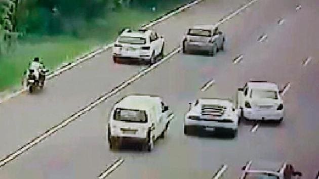 Even though both the Dzire car and the Lamborghini sped away, the Eeco van toppled over several times and fell into a drain along the Expressway.(ANI)