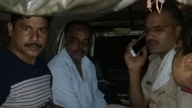 Kamal, 45, (in white shirt) after his arrest on Friday. Police said the former Uber cab driver allegedly used to terrorise his wife and children. (HT Photo) Kamal, 45, (in white shirt) after his arrest on Friday. Police said the former Uber cab driver allegedly used to terrorise his wife and children. (HT Photo)