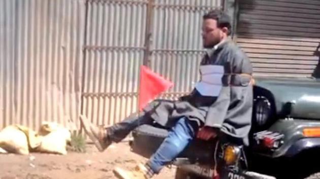 Screengrab of a video showing Farooq Ahmed Dar tied to a jeep as a ‘human shield’ against protesters.The video had triggered outrage in Kashmir. (Twitter/Omar Abdullah) Screengrab of a video showing Farooq Ahmed Dar tied to a jeep as a ‘human shield’ against protesters.The video had triggered outrage in Kashmir. (Twitter/Omar Abdullah)