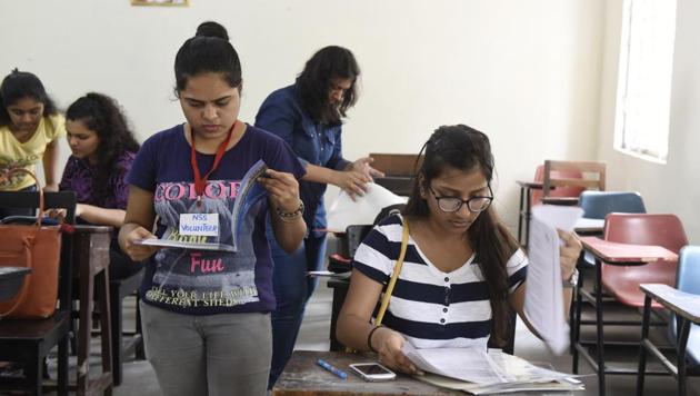 Students complete admission process at Daulat Ram College. Delhi University colleges came out with their fourth cutoff list on July 13. (Saumya Khandelwal/HT Photo) Students complete admission process at Daulat Ram College. Delhi University colleges came out with their fourth cutoff list on July 13. (Saumya Khandelwal/HT Photo)