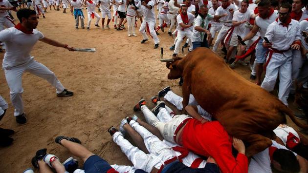 A wild cow leaps over revelers in the bull ring following the fourth running of the bulls at the San Fermin festival. (Joseba Etxaburu / REUTERS) A wild cow leaps over revelers in the bull ring following the fourth running of the bulls at the San Fermin festival. (Joseba Etxaburu / REUTERS)