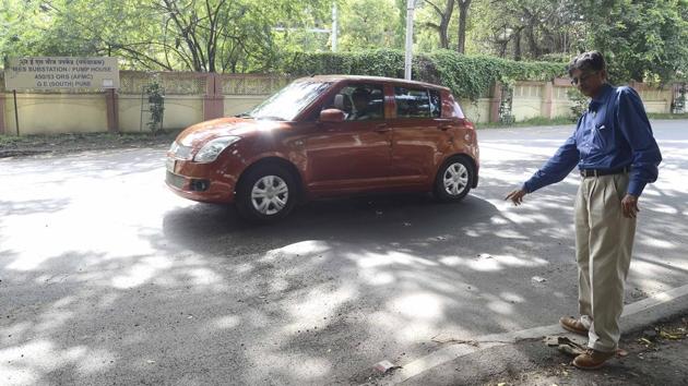 Jaideep Malaviya shows speed breakers that are broken or not visible leading to road mishaps, at many places on the roads in Pune Cantonment areas. (RAVINDRA JOSHI/HT) Jaideep Malaviya shows speed breakers that are broken or not visible leading to road mishaps, at many places on the roads in Pune Cantonment areas. (RAVINDRA JOSHI/HT)
